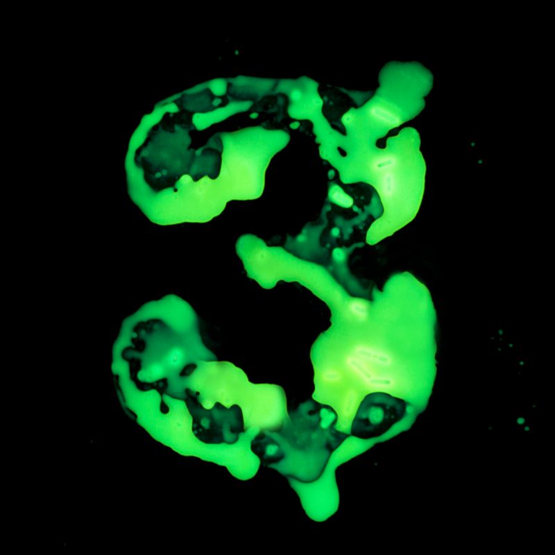 a photograph of the number 3 made out of glowing liquid
