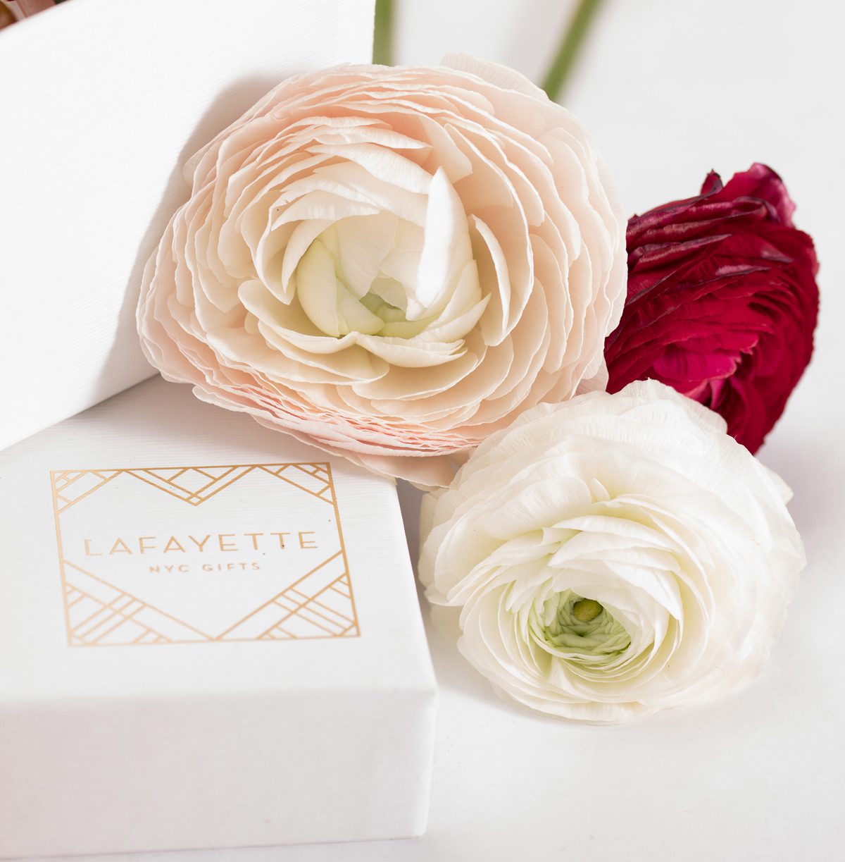 A photograph of a Lafayette Gift box with flowers