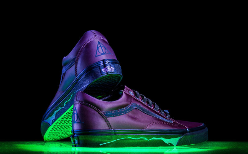 A shot of a pair of Vans shoe underlit with green light.