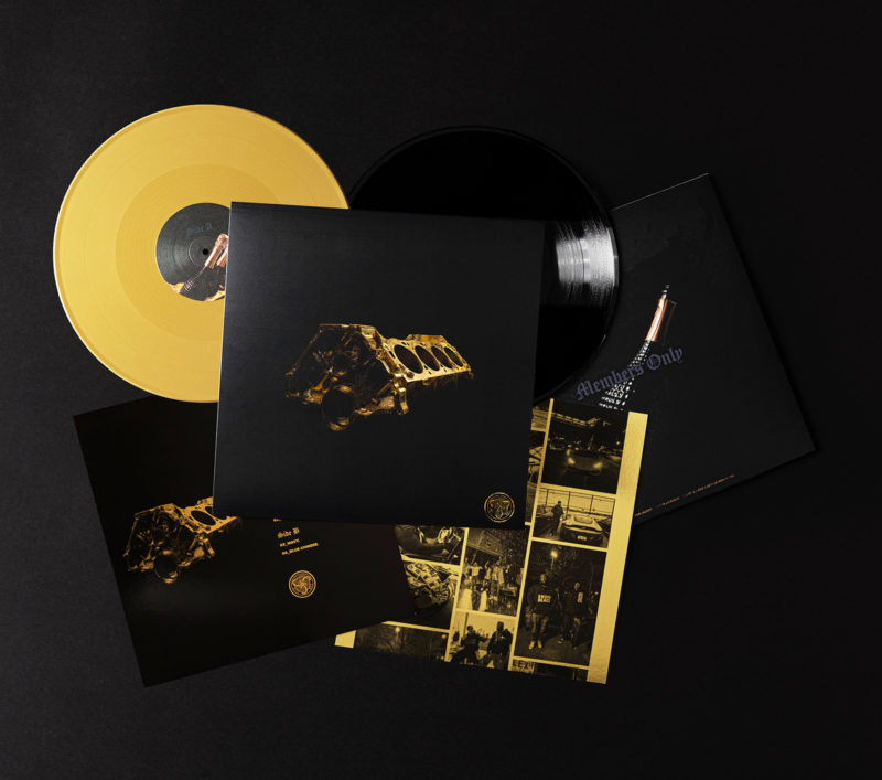A photograph of the members only album packaging — the outer sleeve, 2 vinyl discs and 2 inserts.
