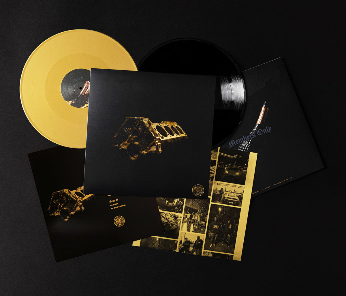 A photograph of a vinyl packaging including the outer sleeve, 2 vinyl discs and 2 inserts.