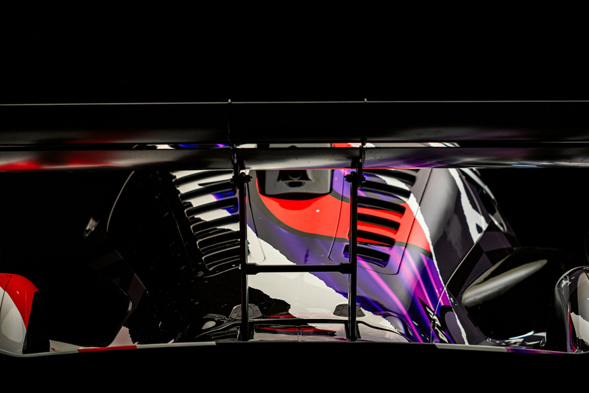 A closeup photo of a Radical RXC racecar spoiler