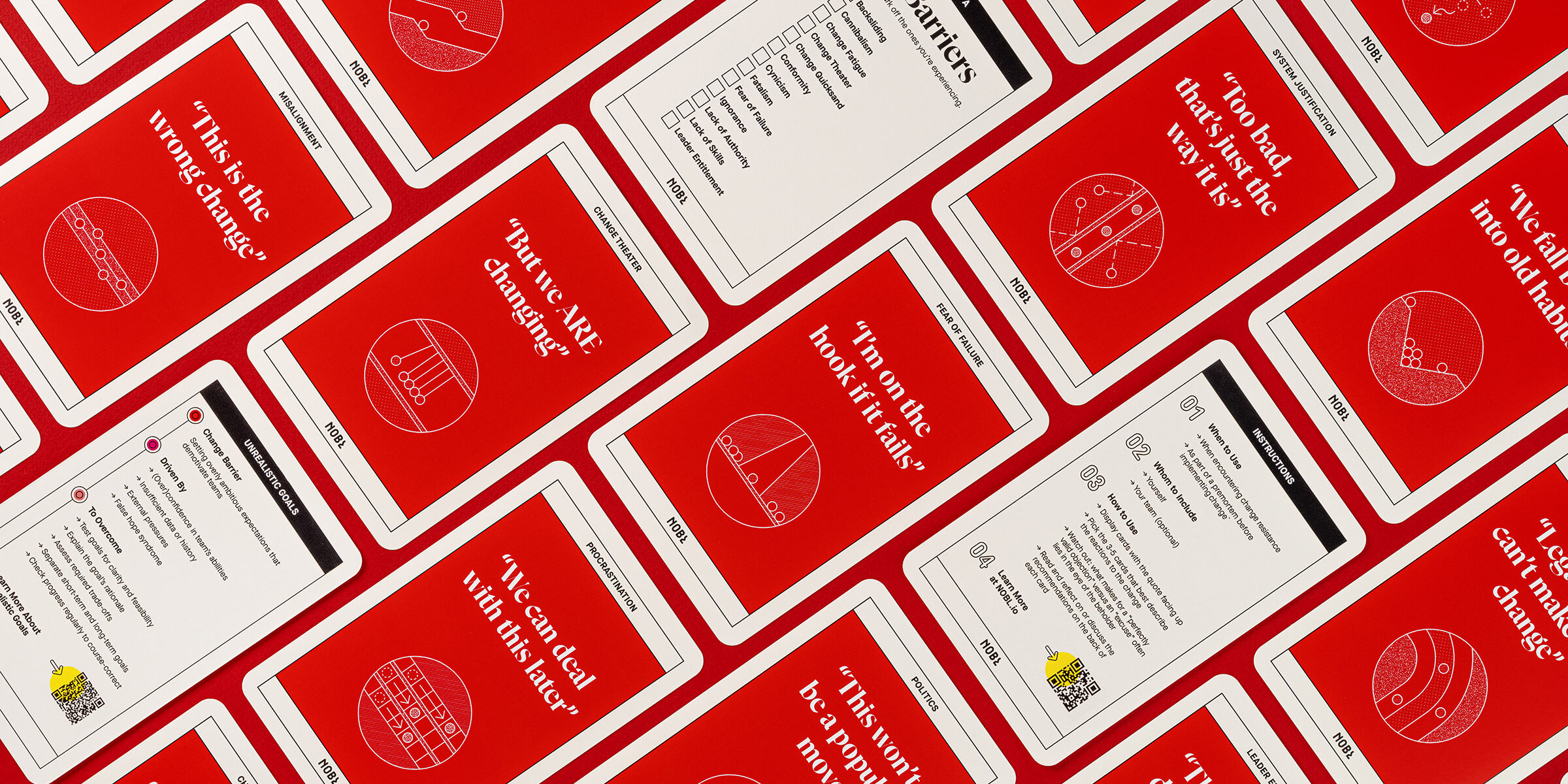 An overhead view of Nobl Change Barrier cards laid out on a red background.